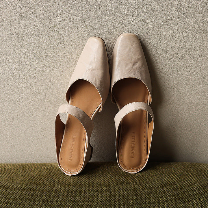 Square-toe leather wedge mules styled with cropped trousers