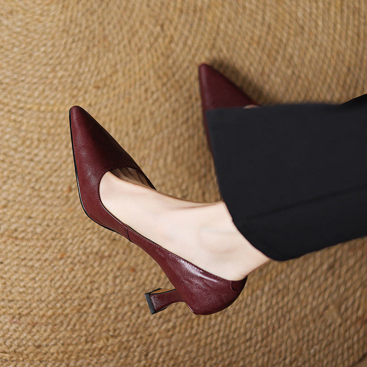 Ivory White lambskin pumps, angled studio shot