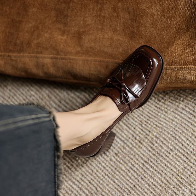 Espresso Brown leather loafer pump with kiltie fringe, three-quarter view