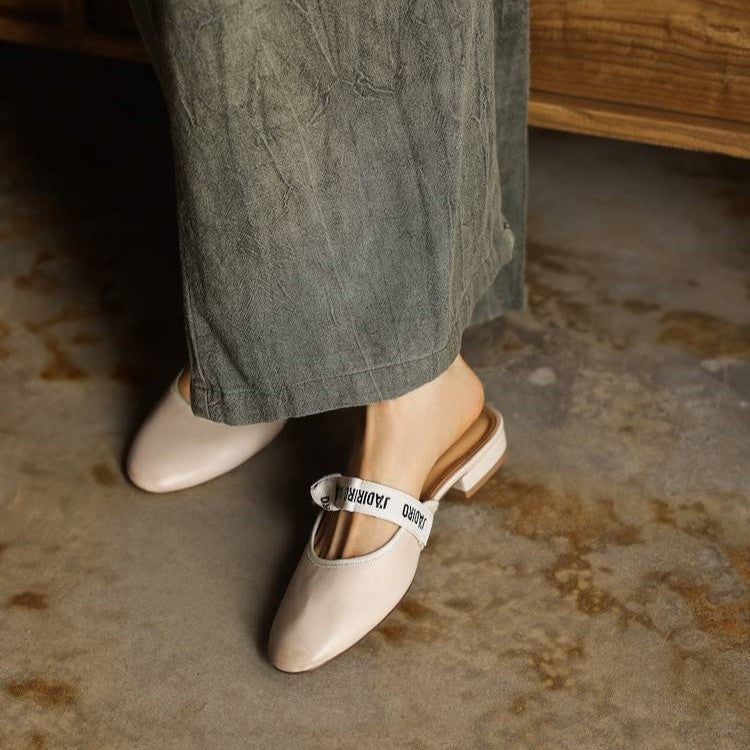 Close-up of low block sole on Adele leather mules
