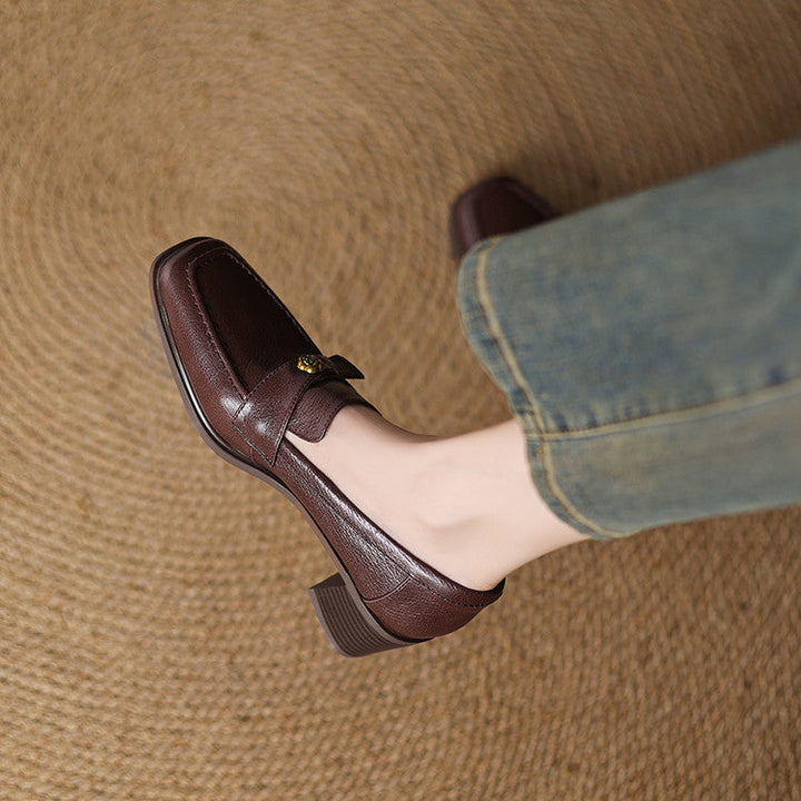 Sylvie loafer pumps, close-up of floral metal accent