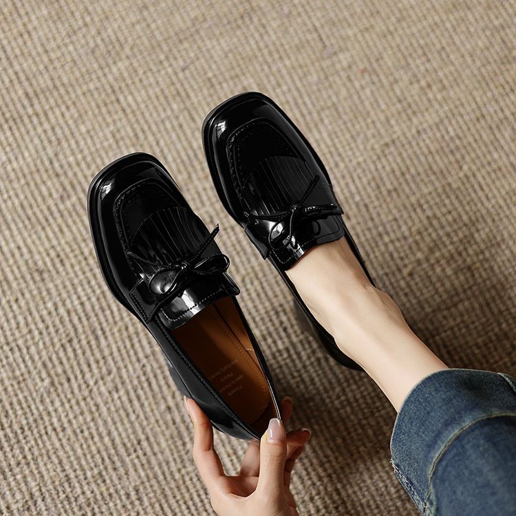 Close-up of block heel on Tabitha leather loafer pumps
