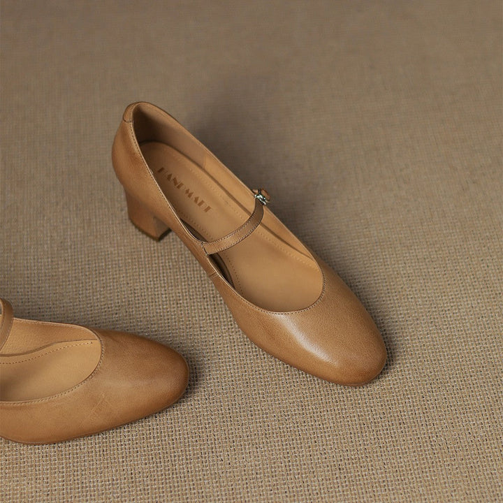Strap leather block heels styled with a dress