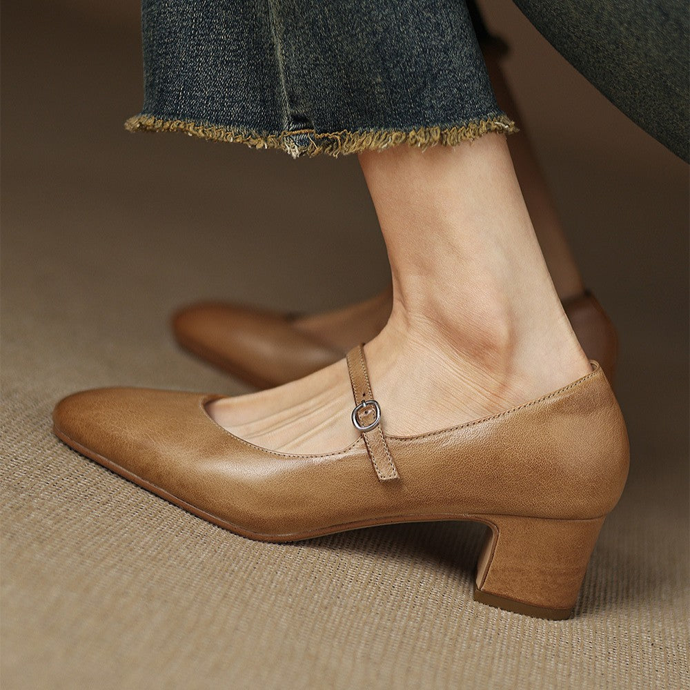 Top-down view of a pointed-toe leather block heel