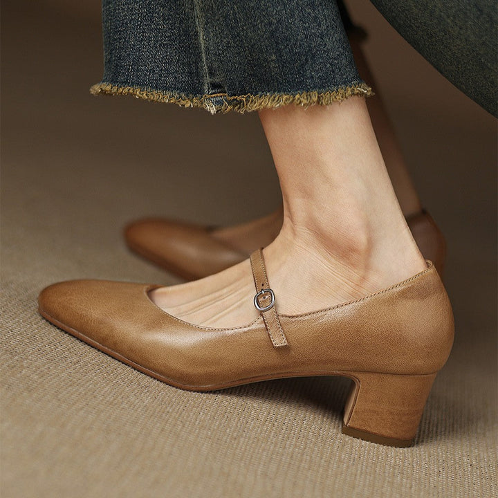 Top-down view of a pointed-toe leather block heel