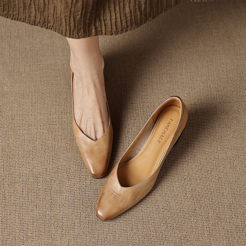 Close-up of genuine cowhide leather on a square-toe pump