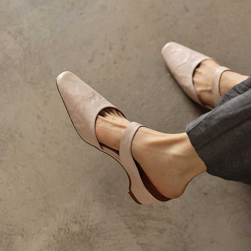 Top-down view of women's square-toe leather slip-on mules