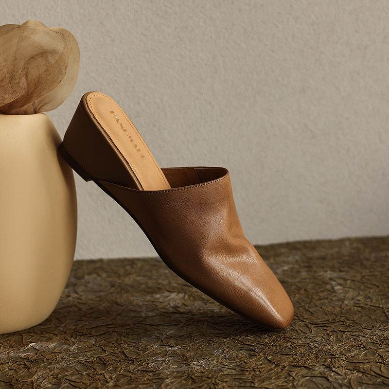 Top-down view of a square-toe leather wedge mule