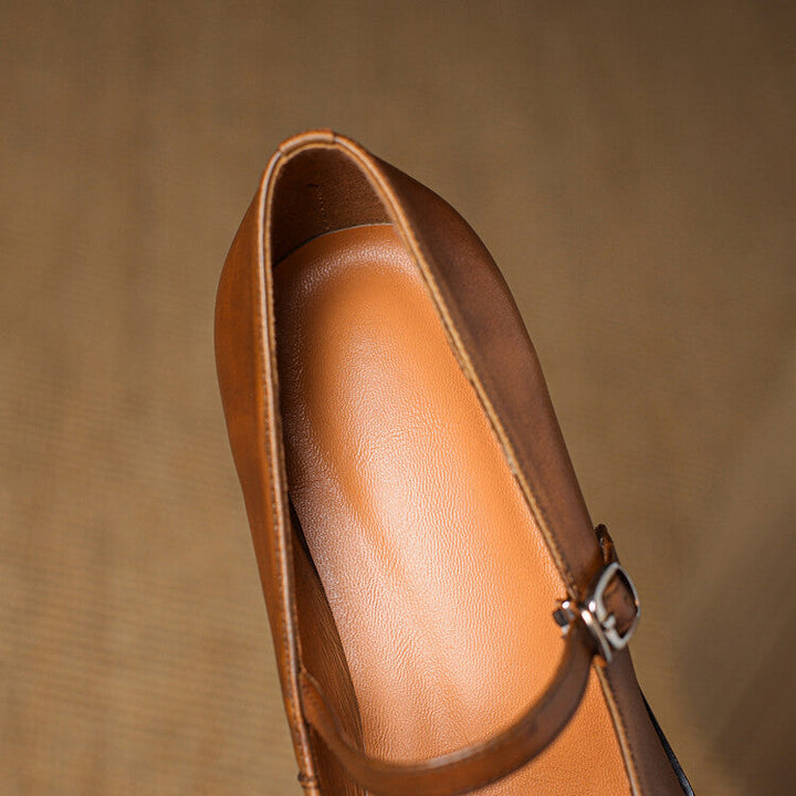 Adjustable strap and stitched detail on a Mary-Jane heel