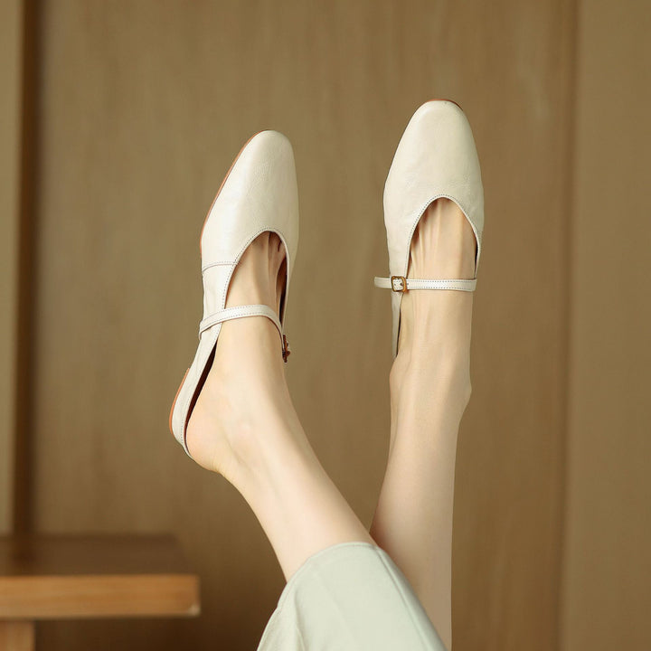 Strap detail on a leather flat mule