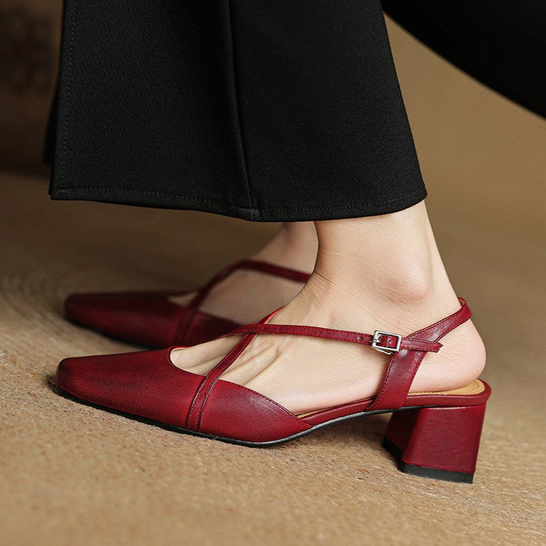 Slingback strap detail on a square-toe leather heel