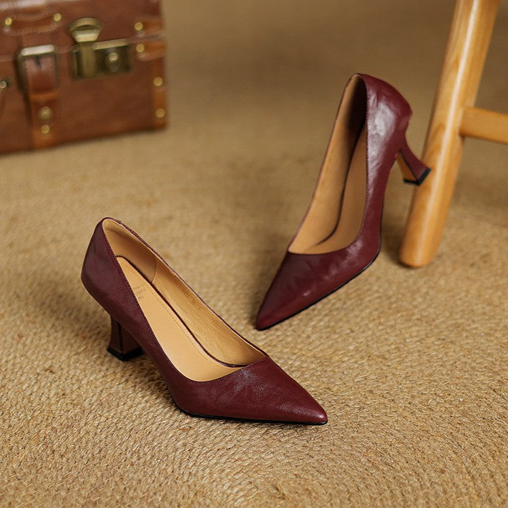 Onyx Black lambskin pumps, angled studio shot