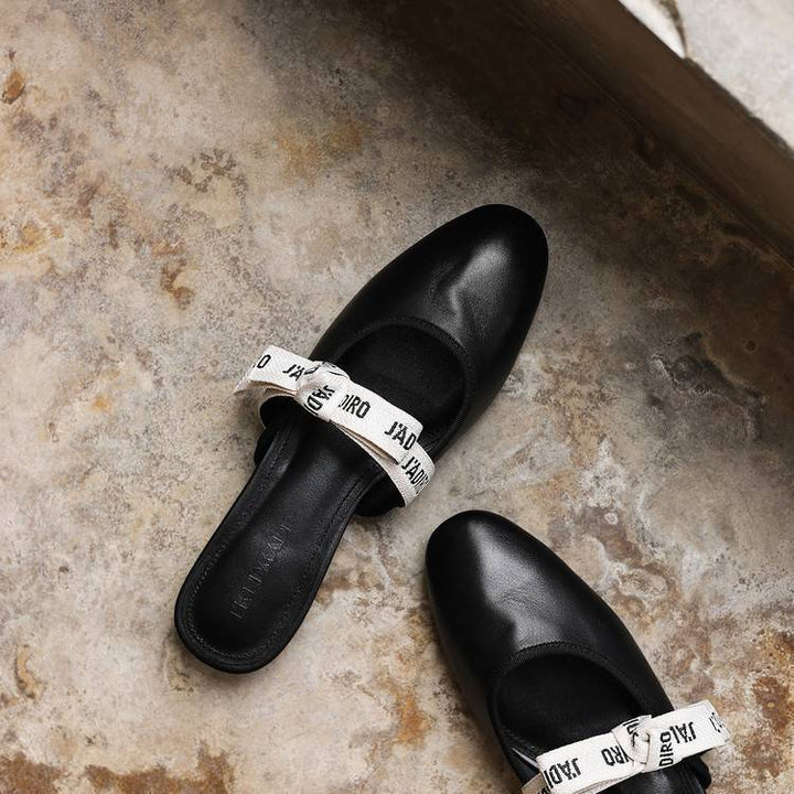 Bow leather heeled mules, top view of Noir Black pair
