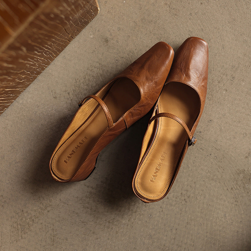 Women's square-toe leather heeled mules shown as a pair