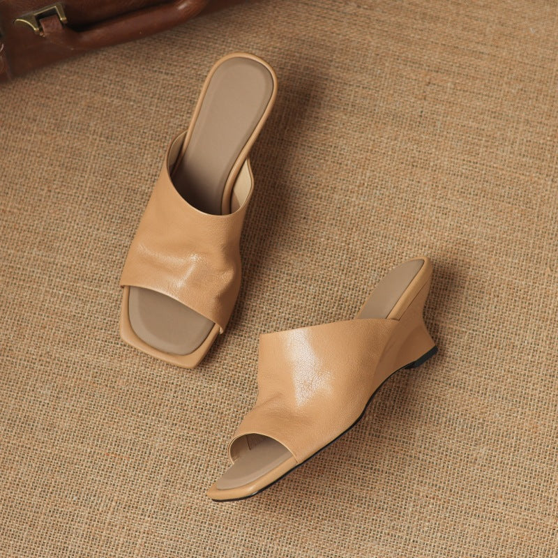 Soft Ivory Gloria wedge mules styled with a summer dress