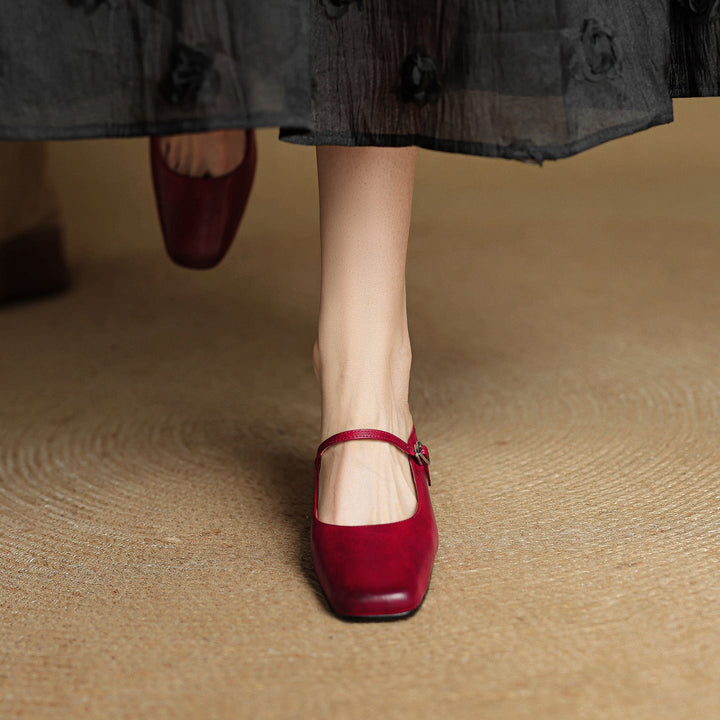 Top-down view of a square-toe leather block mule