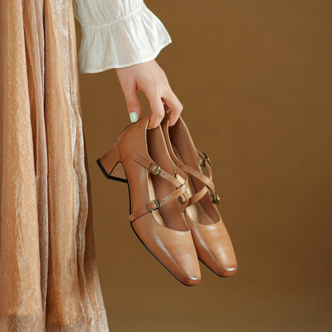 Cross-strap leather Mary-Jane heels, top view of Cognac Brown pair