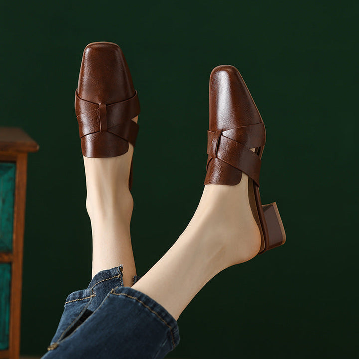 Top-down view of a square-toe cross-strap leather mule
