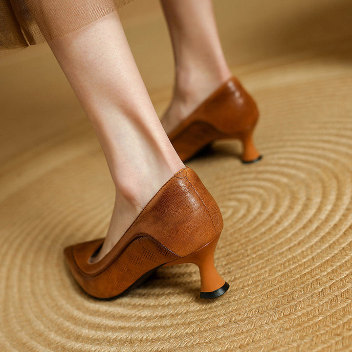 Top-down view of a pointed-toe leather heel