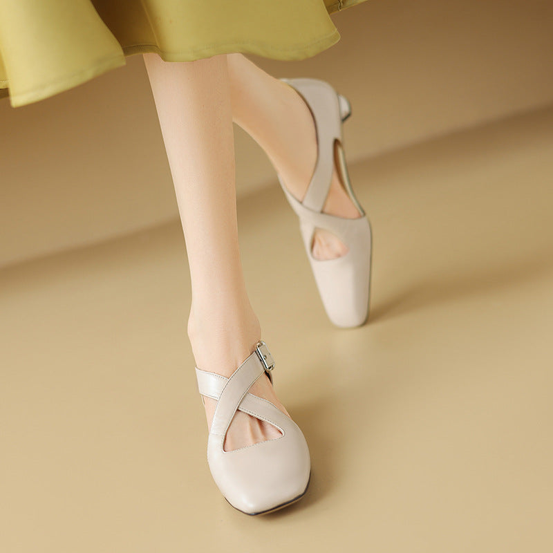 Close-up of block heel on Ramona leather d'Orsay heels