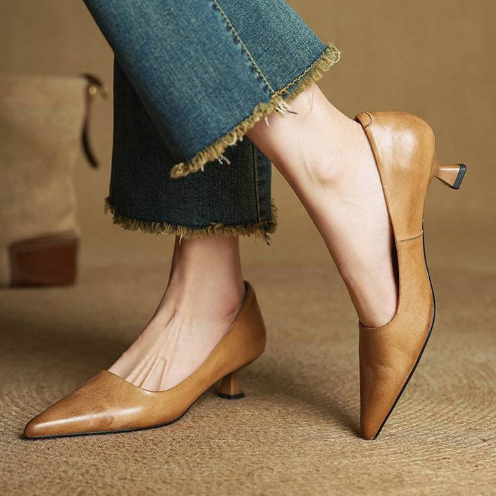 Close-up of top-grain cowhide leather on a pointed kitten heel