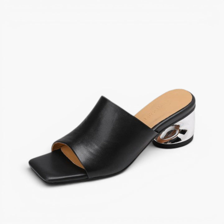 Obsidian Black leather mules, angled studio shot